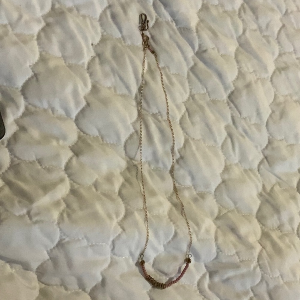 i am selling a gold and rosey pink necklace